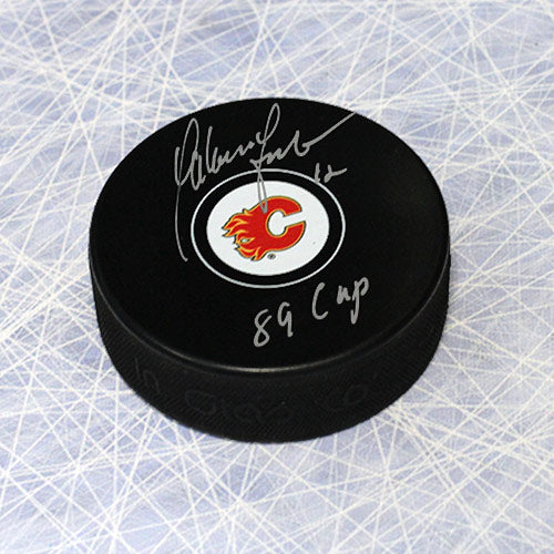 Hakan Loob Calgary Flames Autographed Hockey Puck with 1989 Cup Note | AJ Sports.