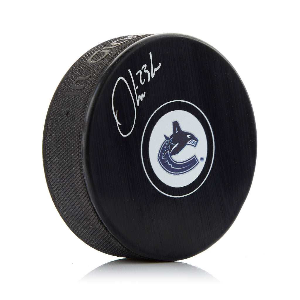 Oliver Ekman-Larsson Vancouver Canucks Autographed Hockey Puck | AJ Sports.