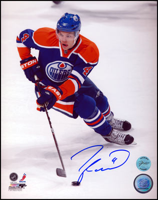 Taylor Hall Edmonton Oilers Signed Puck Control 8x10 Photo | AJ Sports.