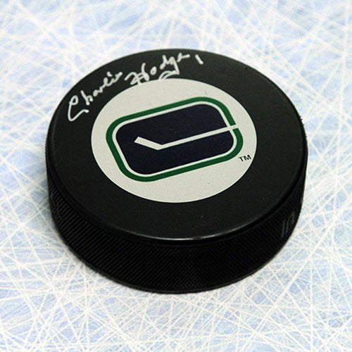 Charlie Hodge Vancouver Canucks Autographed Hockey Puck | AJ Sports.