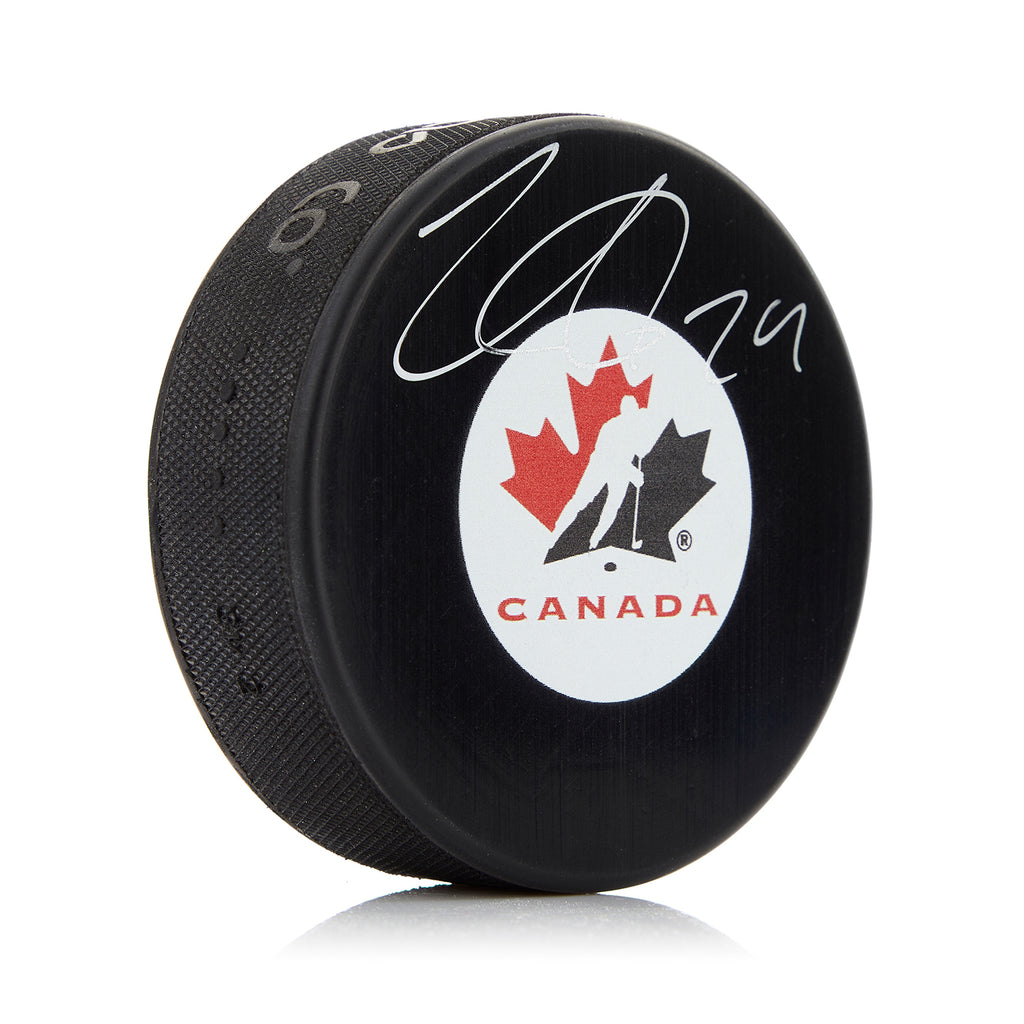 Nathan MacKinnon Team Canada Autographed Hockey Puck | AJ Sports.