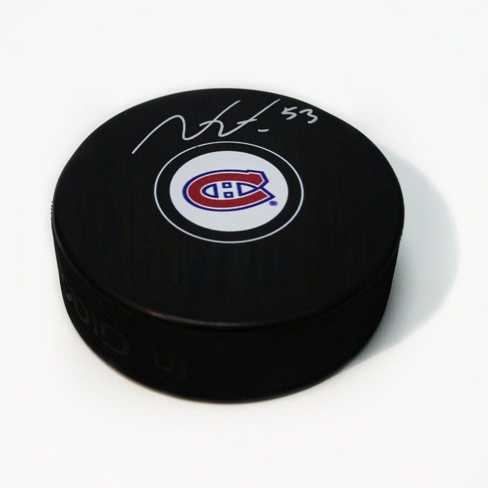 Victor Mete Montreal Canadiens Autographed Hockey Puck | AJ Sports.