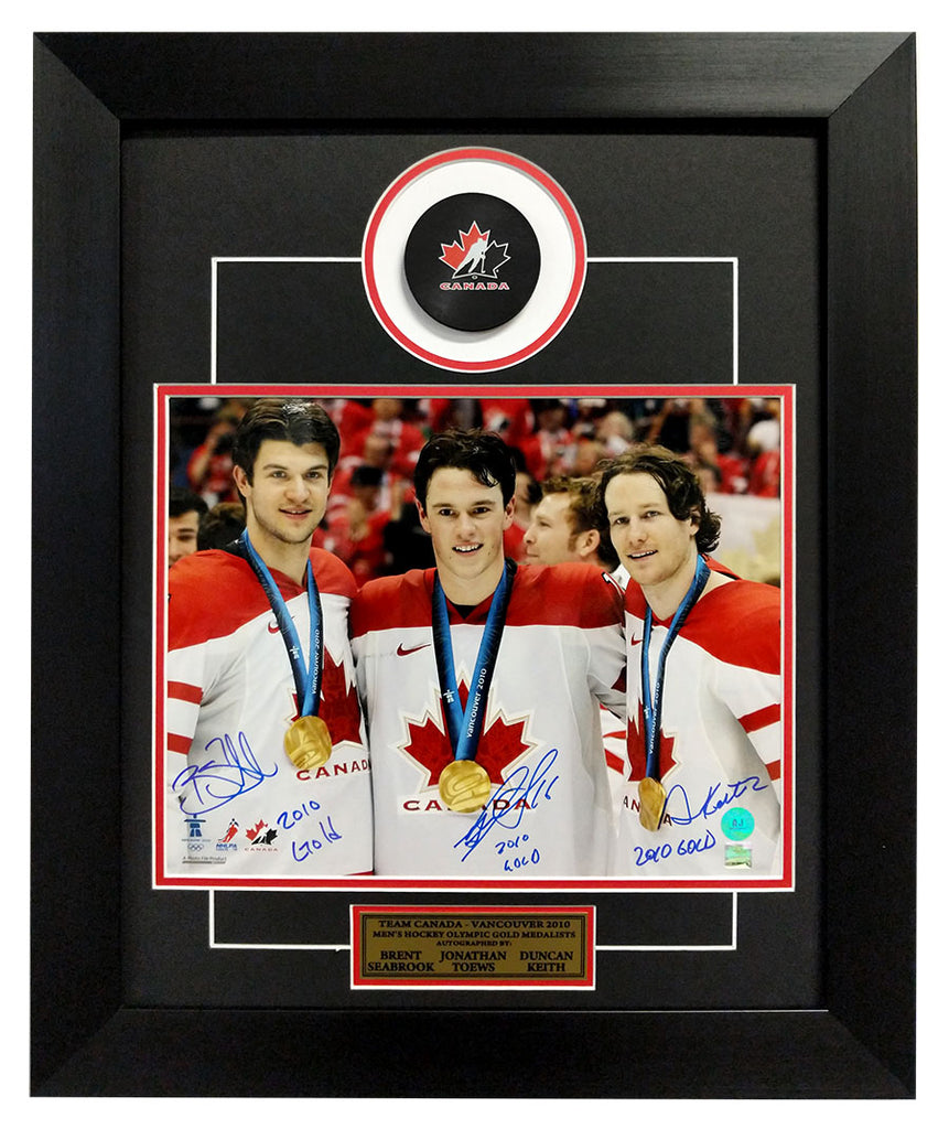 Toews, Keith & Seabrook Triple Signed Blackhawks Canada 2010 Gold 20x24 Frame | AJ Sports.